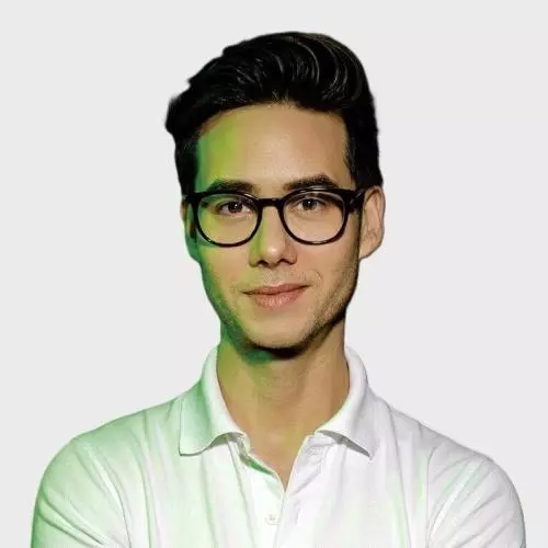 Ryan Velandria Mccarthy wears a white polo shirt and glasses. 