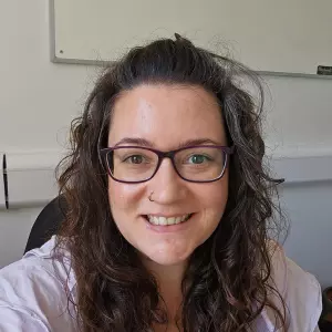  Hannah with long hair wearing glasses