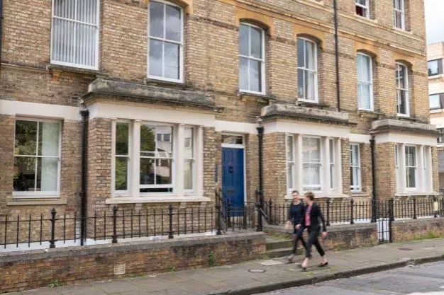 DSPI professional services staff walking past Barnett House