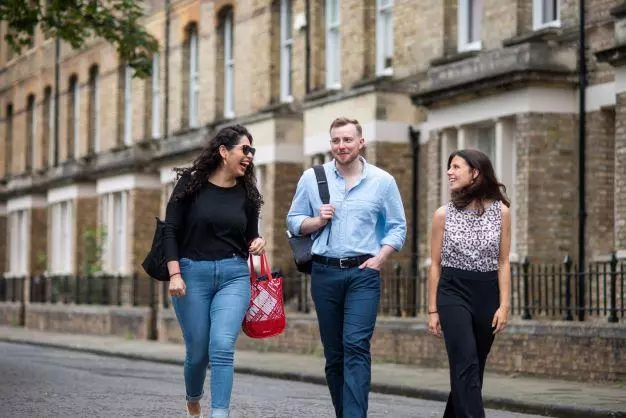 DSPI students walking in the street outside Barnett House